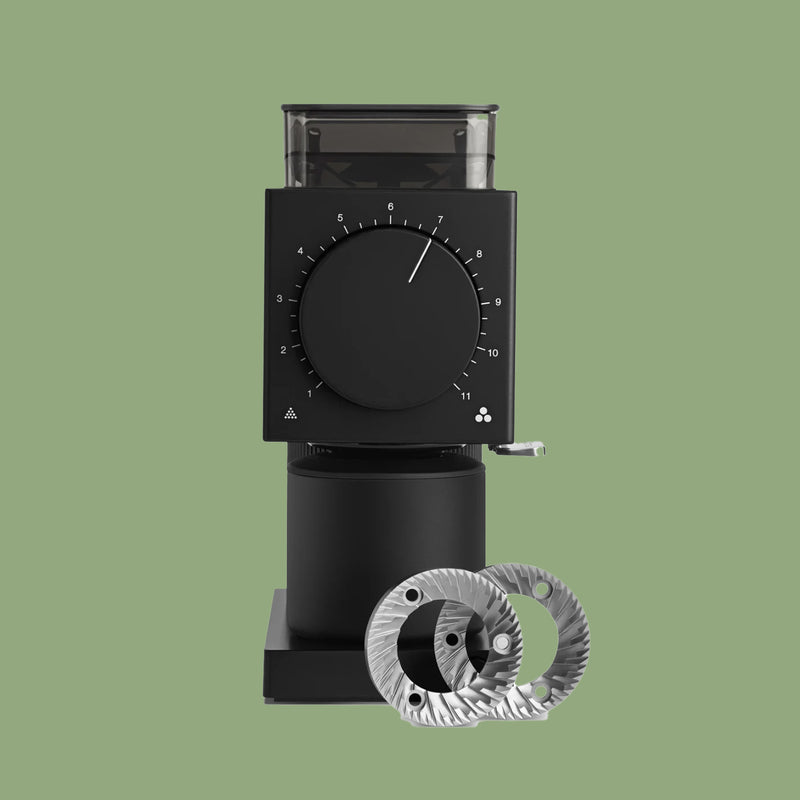 Fellow Ode Gen 2 brew grinder in matte black, front view, with its 64mm flat burrs beside it