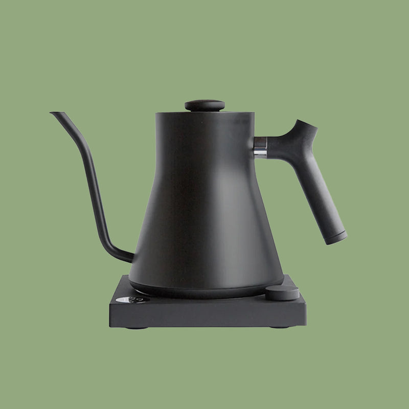 Fellow Stagg EKG electric gooseneck kettle in matte black on its base